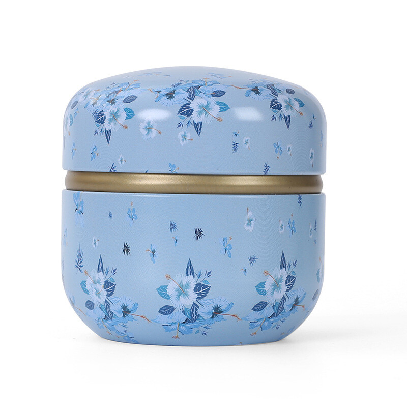Skārda tējas kastes mājsaimniecības aizzīmogotās tējas iepakojuma kaste pārnēsājamas japāņu stila ziedu tējas mazas apaļas skārda kastes