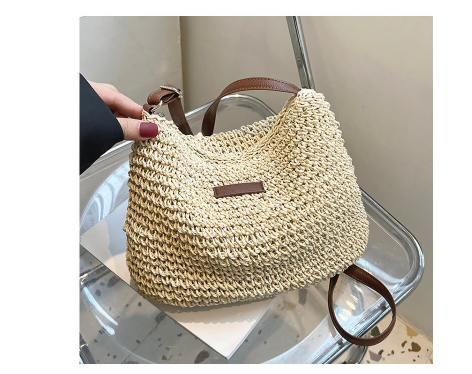 Moteriška vasarinė rankinė, paprasta ir stilinga, tinkanti apsipirkimui ir susitikimams.