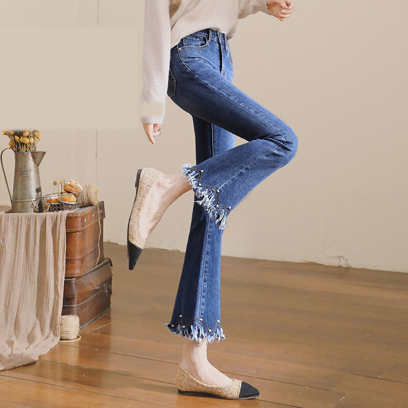 Crne traperice s raširenim rubom za žene za proljeće i jesen 2022., nove elastične uske hlače s devet točaka i neobrađenim rubom, visoki struk, raširene hlače