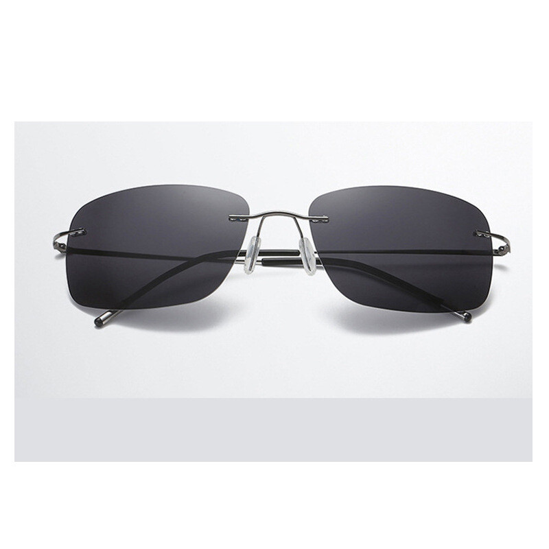 Jaunas bezrāmju B titāna polarizētas krāsu plēves brilles ar kvadrātveida rāmi, salokāmas kājas, bezrāmju vīriešu un sieviešu spoguļattēla braukšanas saulesbrilles