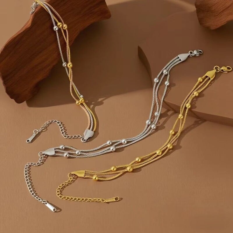 Европейска и американска трансгранична гривна от неръждаема стомана с мъниста от змийска кост, модерен вакуумно галванизиран, устойчив на цвят, лек луксозен производител на бижута на едро.