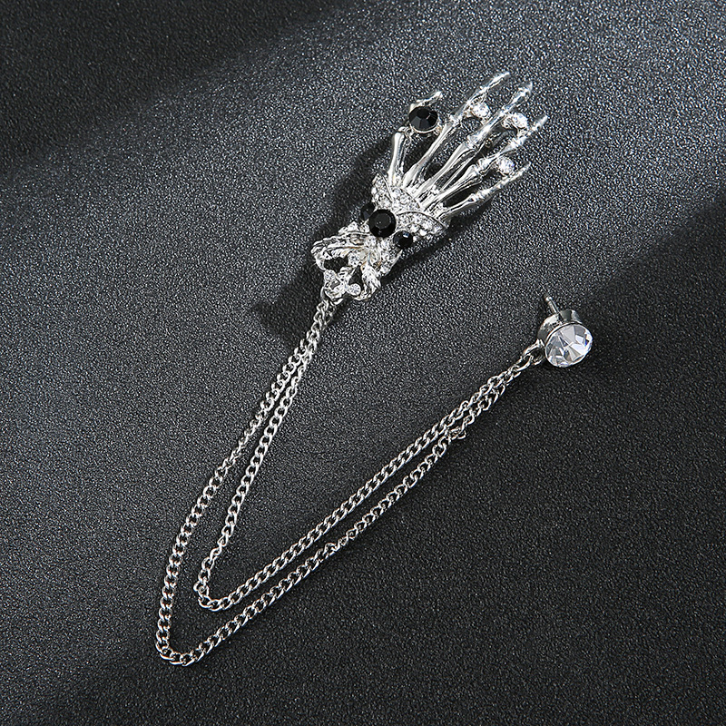 Vyriški personalizuoti kostiumai, derinami su kutais, gitaromis, muzikos instrumentų papuošalais, grandininėmis sagėmis, susukto rutulio sagėmis ir kitais aksesuarais.