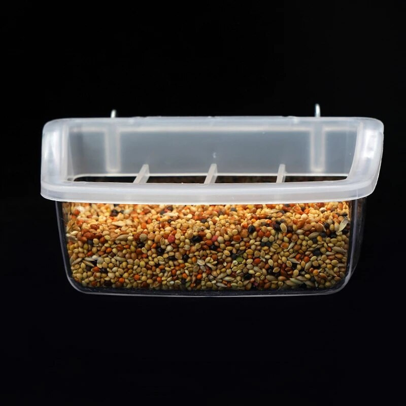 Könnyen etethető madárketrec tartozék Tartós függő madáretető fröccsenésgátló ráccsal a ketrechez. Átlátszó doboz madáreledel madárházhoz