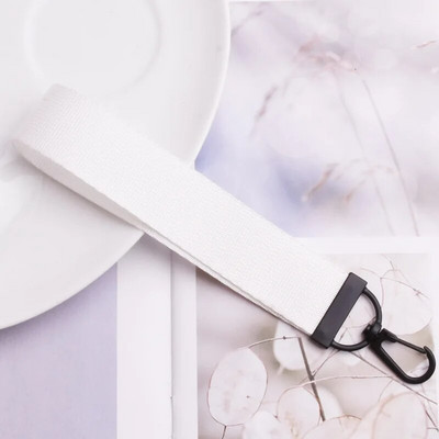 Lentes siksnas Rokas atslēgu piekariņš Cieta siksna Automašīnas atslēgu piekariņi Rokas plaukstas atslēgu turētājs Sieviešu štrope Meiteņu atslēgu soma Mobilais tālrunis