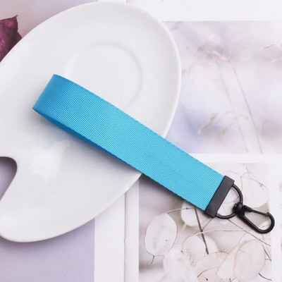 Lentes siksnas Rokas atslēgu piekariņš Cieta siksna Automašīnas atslēgu piekariņi Rokas plaukstas atslēgu turētājs Sieviešu štrope Meiteņu atslēgu soma Mobilais tālrunis