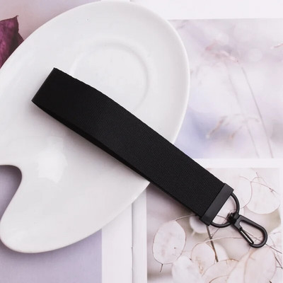 Lentes siksnas Rokas atslēgu piekariņš Cieta siksna Automašīnas atslēgu piekariņi Rokas plaukstas atslēgu turētājs Sieviešu štrope Meiteņu atslēgu soma Mobilais tālrunis