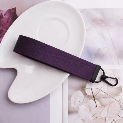 Lentes siksnas Rokas atslēgu piekariņš Cieta siksna Automašīnas atslēgu piekariņi Rokas plaukstas atslēgu turētājs Sieviešu štrope Meiteņu atslēgu soma Mobilais tālrunis