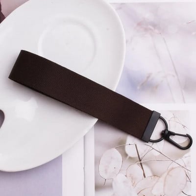 Lentes siksnas Rokas atslēgu piekariņš Cieta siksna Automašīnas atslēgu piekariņi Rokas plaukstas atslēgu turētājs Sieviešu štrope Meiteņu atslēgu soma Mobilais tālrunis