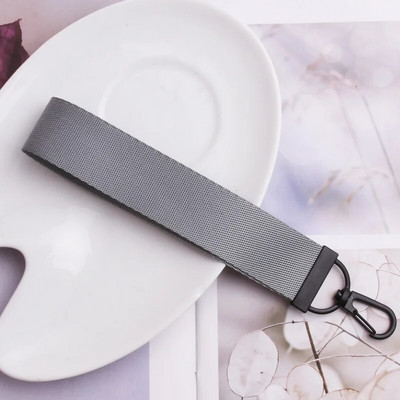 Lentes siksnas Rokas atslēgu piekariņš Cieta siksna Automašīnas atslēgu piekariņi Rokas plaukstas atslēgu turētājs Sieviešu štrope Meiteņu atslēgu soma Mobilais tālrunis