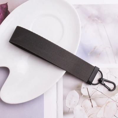 Lentes siksnas Rokas atslēgu piekariņš Cieta siksna Automašīnas atslēgu piekariņi Rokas plaukstas atslēgu turētājs Sieviešu štrope Meiteņu atslēgu soma Mobilais tālrunis