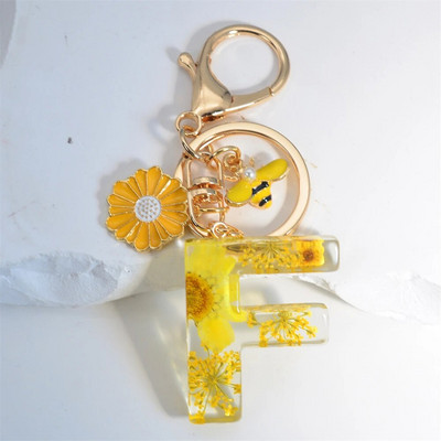 Χαριτωμένο τεχνητό μενταγιόν μαργαριτάρι μελισσών 26 γράμματα Μπρελόκ Μόδα μαργαρίτα με λουλούδι μπρελόκ με ρητίνη Γυναικεία ανδρική τσάντα αυτοκινήτου Γραφικό στοιχείο τηλεφώνου