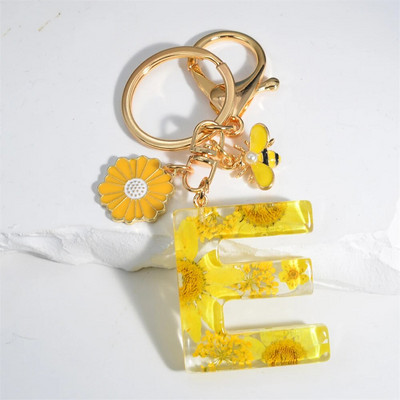 Χαριτωμένο τεχνητό μενταγιόν μαργαριτάρι μελισσών 26 γράμματα Μπρελόκ Μόδα μαργαρίτα με λουλούδι μπρελόκ με ρητίνη Γυναικεία ανδρική τσάντα αυτοκινήτου Γραφικό στοιχείο τηλεφώνου