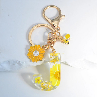 Χαριτωμένο τεχνητό μενταγιόν μαργαριτάρι μελισσών 26 γράμματα Μπρελόκ Μόδα μαργαρίτα με λουλούδι μπρελόκ με ρητίνη Γυναικεία ανδρική τσάντα αυτοκινήτου Γραφικό στοιχείο τηλεφώνου