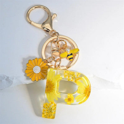 Χαριτωμένο τεχνητό μενταγιόν μαργαριτάρι μελισσών 26 γράμματα Μπρελόκ Μόδα μαργαρίτα με λουλούδι μπρελόκ με ρητίνη Γυναικεία ανδρική τσάντα αυτοκινήτου Γραφικό στοιχείο τηλεφώνου