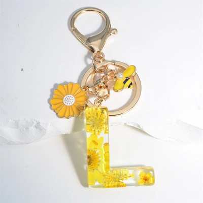 Χαριτωμένο τεχνητό μενταγιόν μαργαριτάρι μελισσών 26 γράμματα Μπρελόκ Μόδα μαργαρίτα με λουλούδι μπρελόκ με ρητίνη Γυναικεία ανδρική τσάντα αυτοκινήτου Γραφικό στοιχείο τηλεφώνου