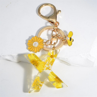 Χαριτωμένο τεχνητό μενταγιόν μαργαριτάρι μελισσών 26 γράμματα Μπρελόκ Μόδα μαργαρίτα με λουλούδι μπρελόκ με ρητίνη Γυναικεία ανδρική τσάντα αυτοκινήτου Γραφικό στοιχείο τηλεφώνου