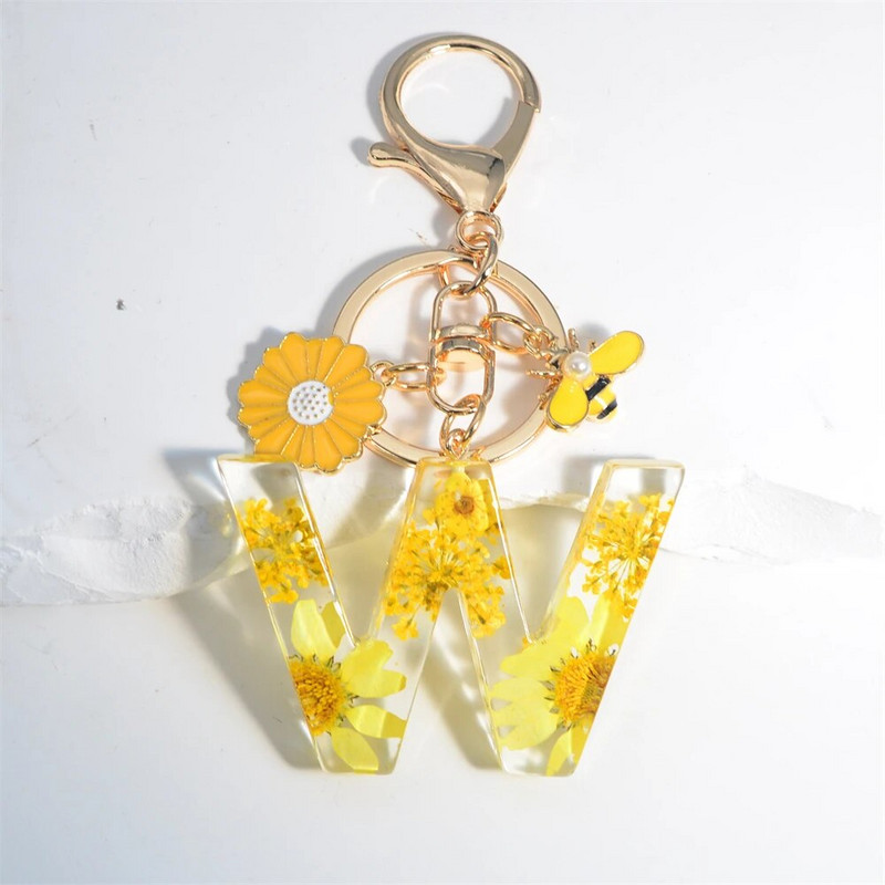 Χαριτωμένο τεχνητό μενταγιόν μαργαριτάρι μελισσών 26 γράμματα Μπρελόκ Μόδα μαργαρίτα με λουλούδι μπρελόκ με ρητίνη Γυναικεία ανδρική τσάντα αυτοκινήτου Γραφικό στοιχείο τηλεφώνου