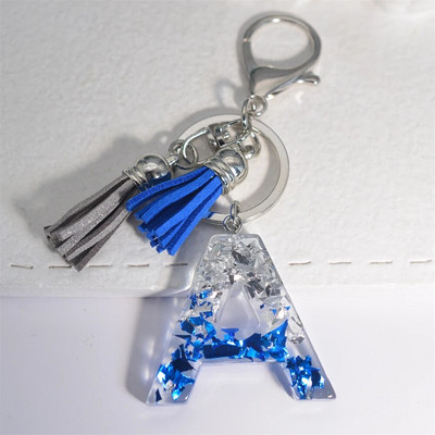 Radoši 26 burtu sveķu atslēgu piekariņi ar pušķi.