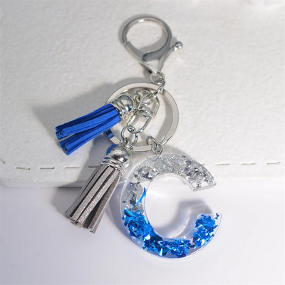 Radoši 26 burtu sveķu atslēgu piekariņi ar pušķi.