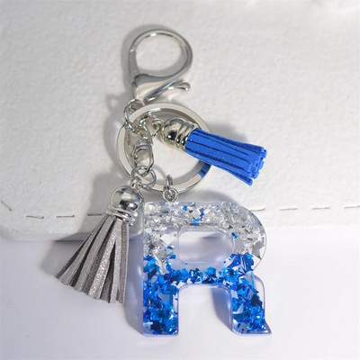 Radoši 26 burtu sveķu atslēgu piekariņi ar pušķi.