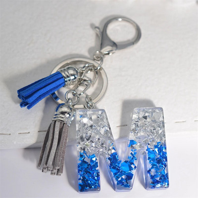 Radoši 26 burtu sveķu atslēgu piekariņi ar pušķi.