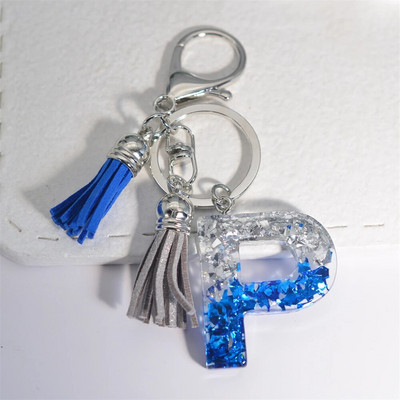 Radoši 26 burtu sveķu atslēgu piekariņi ar pušķi.