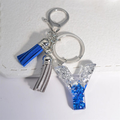 Radoši 26 burtu sveķu atslēgu piekariņi ar pušķi.