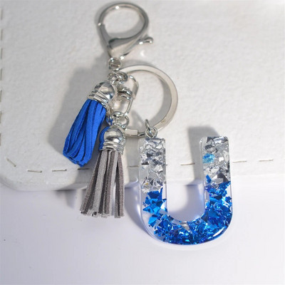 Radoši 26 burtu sveķu atslēgu piekariņi ar pušķi.