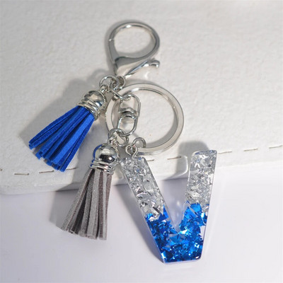 Radoši 26 burtu sveķu atslēgu piekariņi ar pušķi.