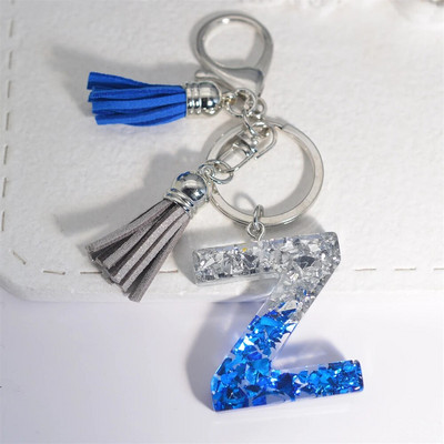 Radoši 26 burtu sveķu atslēgu piekariņi ar pušķi.