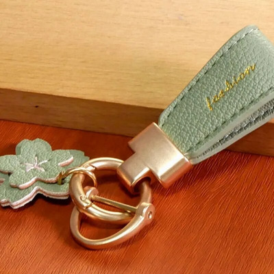 Luksusa metāla īss ādas ziedu oranžs auto atslēgu piekariņš kulons, sadalīts atslēgu piekariņš sievietei, meitenei, siksniņa, modes atslēgu piekariņa aksesuāri