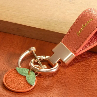 Luksusa metāla īss ādas ziedu oranžs auto atslēgu piekariņš kulons, sadalīts atslēgu piekariņš sievietei, meitenei, siksniņa, modes atslēgu piekariņa aksesuāri