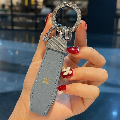 Modes metāla ādas automašīnas atslēgu piekariņa kulons sadalīts gredzens atslēgu piekariņš Rhinestone luksusa atslēgu piekariņš sievietei, meitenīga siksna Auto aksesuāri