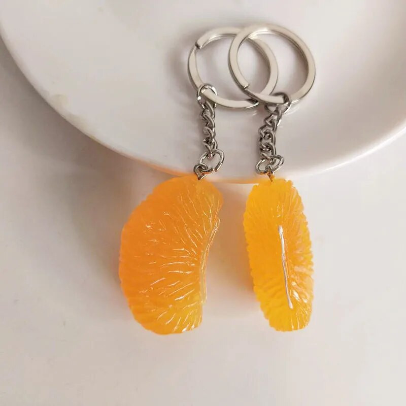 Simulācijas sveķu oranžo atslēgu piekariņu kulonu pārtikas un augļu atslēgu ķēdes vairumtirdzniecība