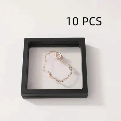 10 gab. Rotaslietu aksesuāri Iepakojuma displeja piederumi Uzglabāšanas kaste PE plēves balstiekārta caurspīdīga kaklarota