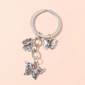 Jauki sakausējuma tauriņi atslēgu piekariņi metāla dzīvnieku atslēgu piekariņi kuloni atslēgu turētājam rokassomu dekoru piekariņi DIY rotaslietas dāvanas