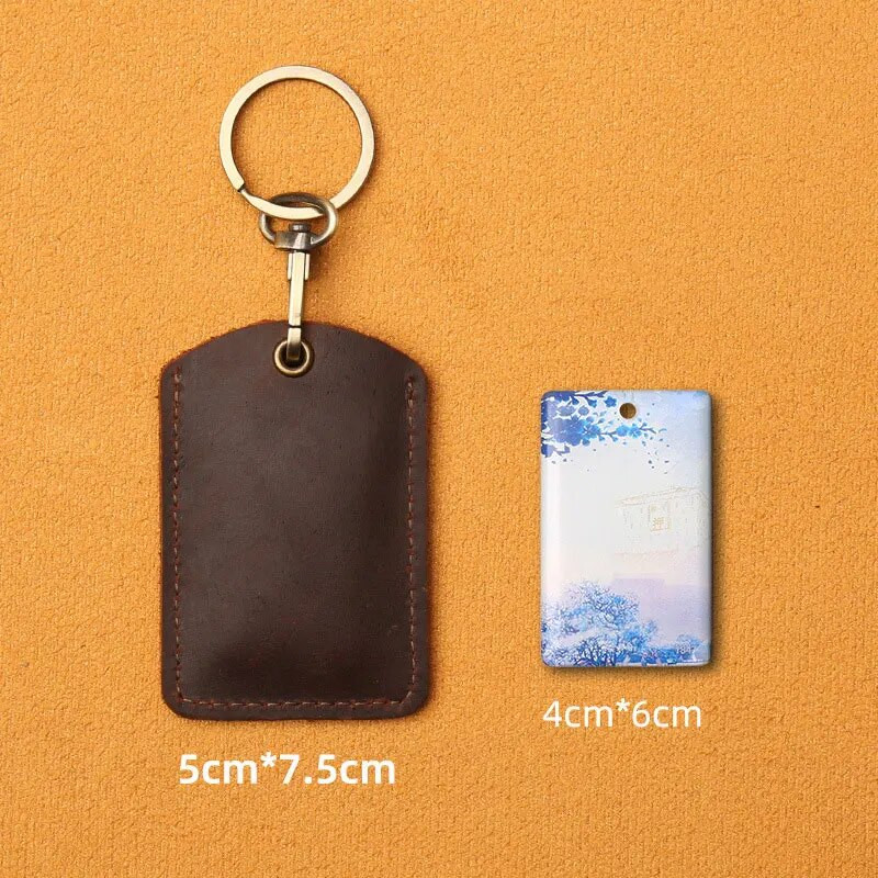 Ādas piekļuves karšu vāciņš Atslēgu piekariņš Kabatas autobusa karšu atslēgu piekariņi Mobilā tālruņa soma Automašīnas kulons atslēgu piekariņš Dāvanu aksesuāri Atslēgu piekariņš