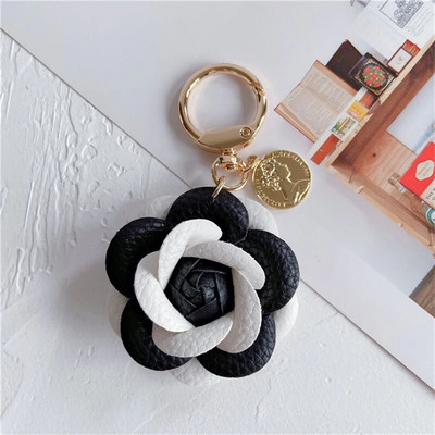Luxury Black White Camellia Γνήσιο δέρμα Λουλούδι Μπρελόκ Γράμμα Ομπρέλα Κρεμαστό Κρεμαστό Κρεμαστό Κρεμαστό Κρεμαστό Κρεμαστό Κρεμαστό Κρεμαστό Κρεμαστό για Τσάντα Αξεσουάρ
