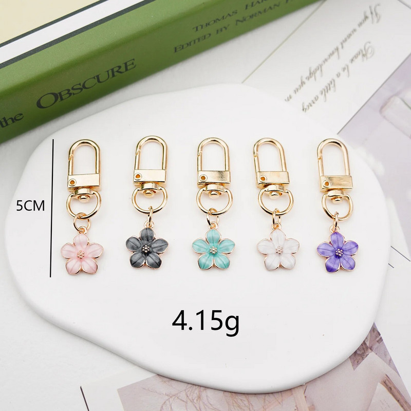 Skaists Sakura ziedu atslēgu piekariņš, emalja violets zaļš rozā balts melns sieviešu atslēgu piekariņš