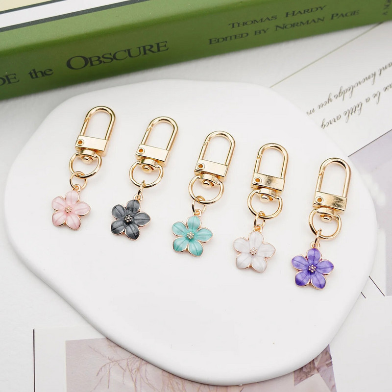 Skaists Sakura ziedu atslēgu piekariņš, emalja violets zaļš rozā balts melns sieviešu atslēgu piekariņš