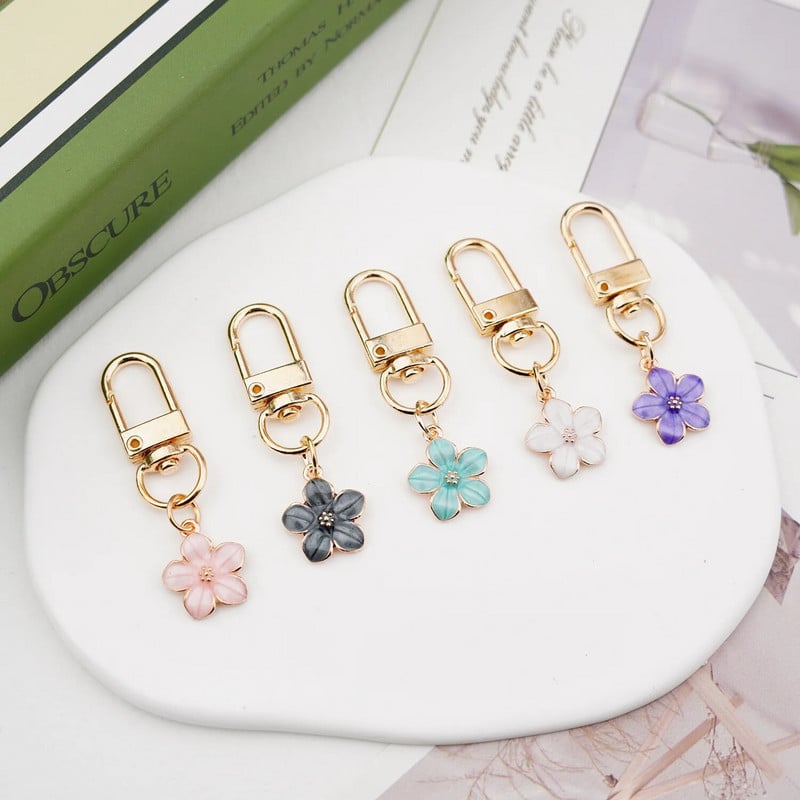 Skaists Sakura ziedu atslēgu piekariņš, emalja violets zaļš rozā balts melns sieviešu atslēgu piekariņš
