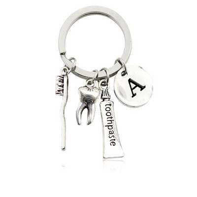 Radoša personība 26 vēstules ar zobu birstes zobu pastu Atslēgu piekariņš Zobi Veselības aizsardzības izpratne Piemiņas rotaslietas