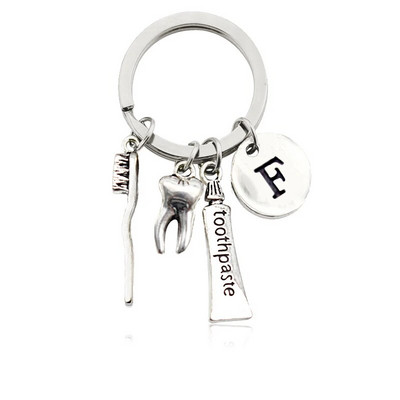 Radoša personība 26 vēstules ar zobu birstes zobu pastu Atslēgu piekariņš Zobi Veselības aizsardzības izpratne Piemiņas rotaslietas