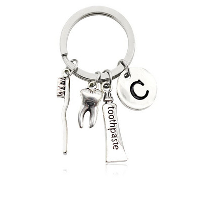 Radoša personība 26 vēstules ar zobu birstes zobu pastu Atslēgu piekariņš Zobi Veselības aizsardzības izpratne Piemiņas rotaslietas