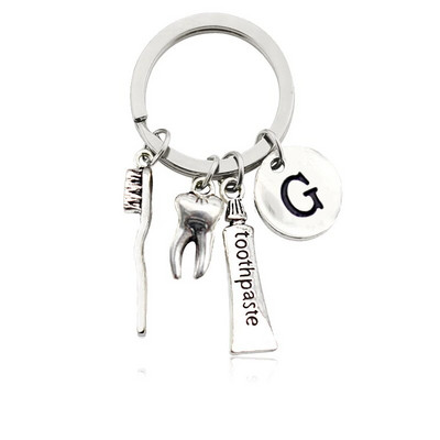 Radoša personība 26 vēstules ar zobu birstes zobu pastu Atslēgu piekariņš Zobi Veselības aizsardzības izpratne Piemiņas rotaslietas