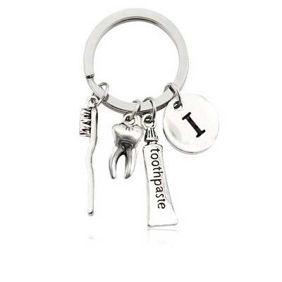 Radoša personība 26 vēstules ar zobu birstes zobu pastu Atslēgu piekariņš Zobi Veselības aizsardzības izpratne Piemiņas rotaslietas