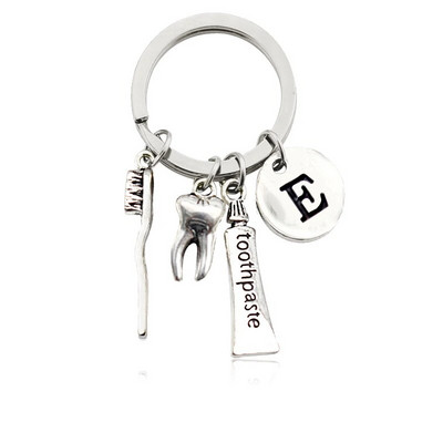 Radoša personība 26 vēstules ar zobu birstes zobu pastu Atslēgu piekariņš Zobi Veselības aizsardzības izpratne Piemiņas rotaslietas