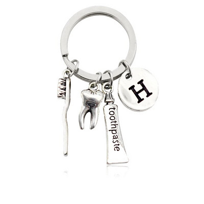 Radoša personība 26 vēstules ar zobu birstes zobu pastu Atslēgu piekariņš Zobi Veselības aizsardzības izpratne Piemiņas rotaslietas