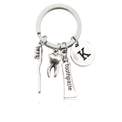 Radoša personība 26 vēstules ar zobu birstes zobu pastu Atslēgu piekariņš Zobi Veselības aizsardzības izpratne Piemiņas rotaslietas