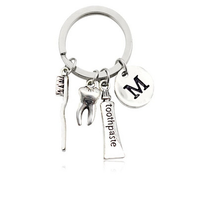 Radoša personība 26 vēstules ar zobu birstes zobu pastu Atslēgu piekariņš Zobi Veselības aizsardzības izpratne Piemiņas rotaslietas